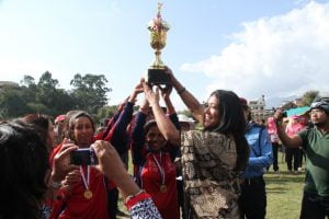 Senior Advocate Sapana Malla giving winning trophy to the winning team Nepal.
