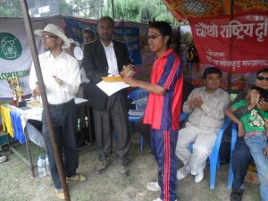 Valley Captain Kirtan Shrestha Duwal receiving Man of the Series fromNFDN Prisident Mr Sudershan Subedi