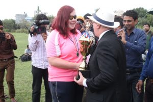 Loise turnner receving the Second Position trofhy from the Ambassador of UK to Nepal.